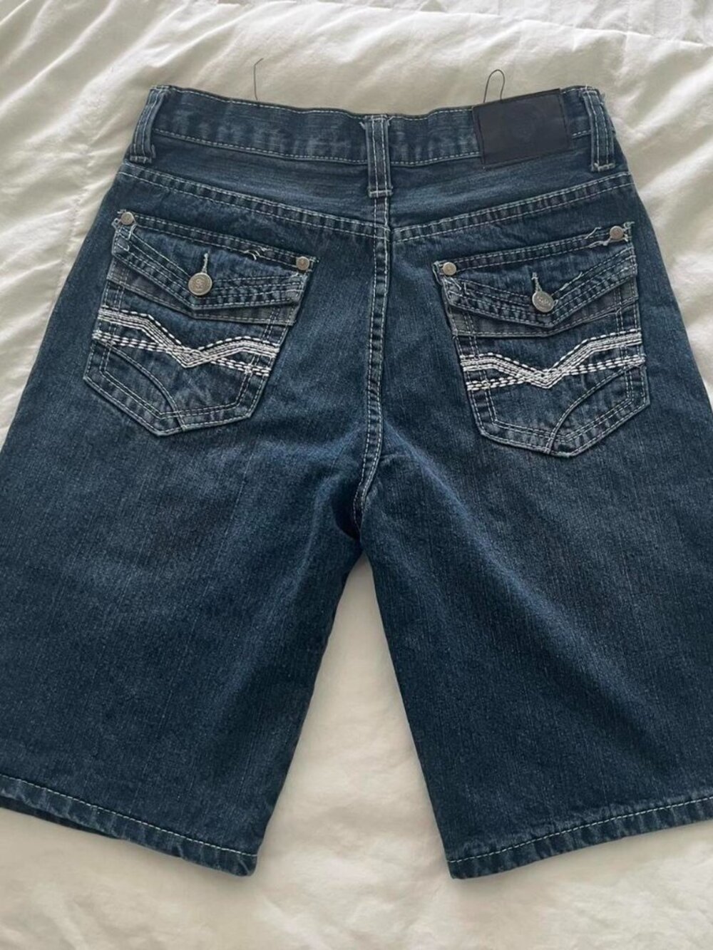 dark wash denim jorts with white stitching & embroidery on back pockets